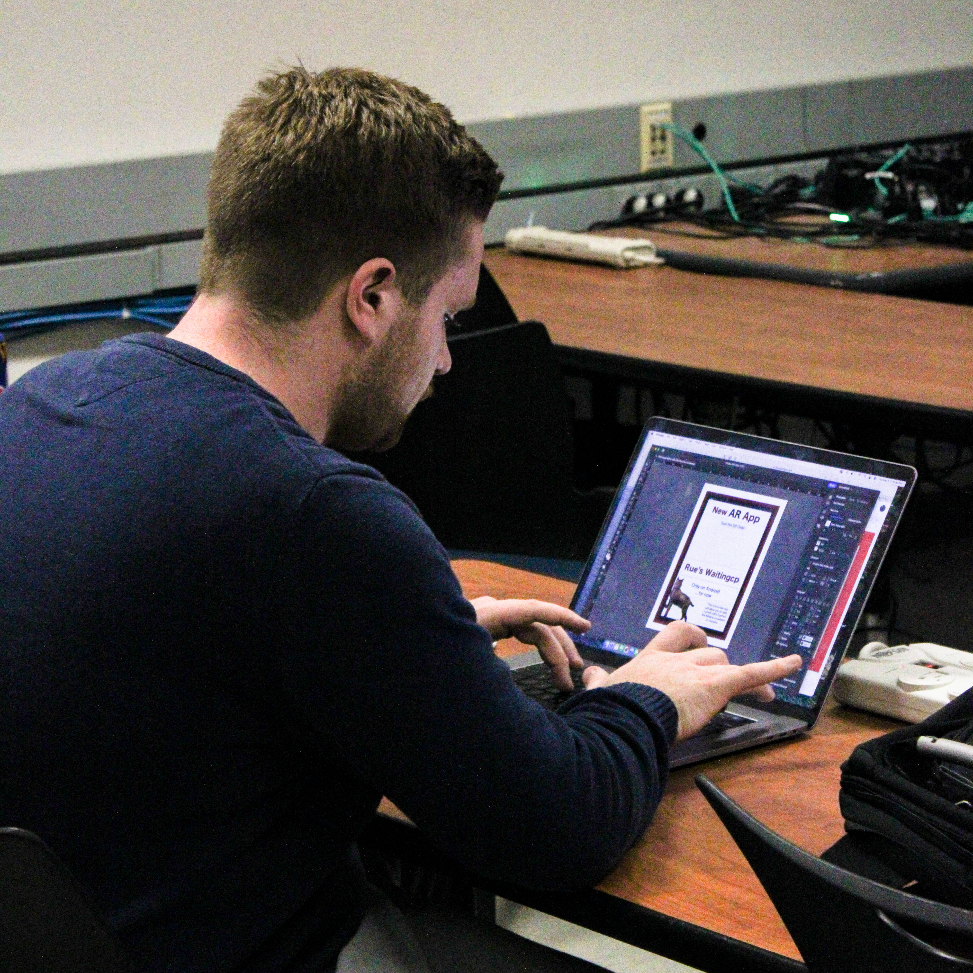 Josh Mannix working on designing for the app.
