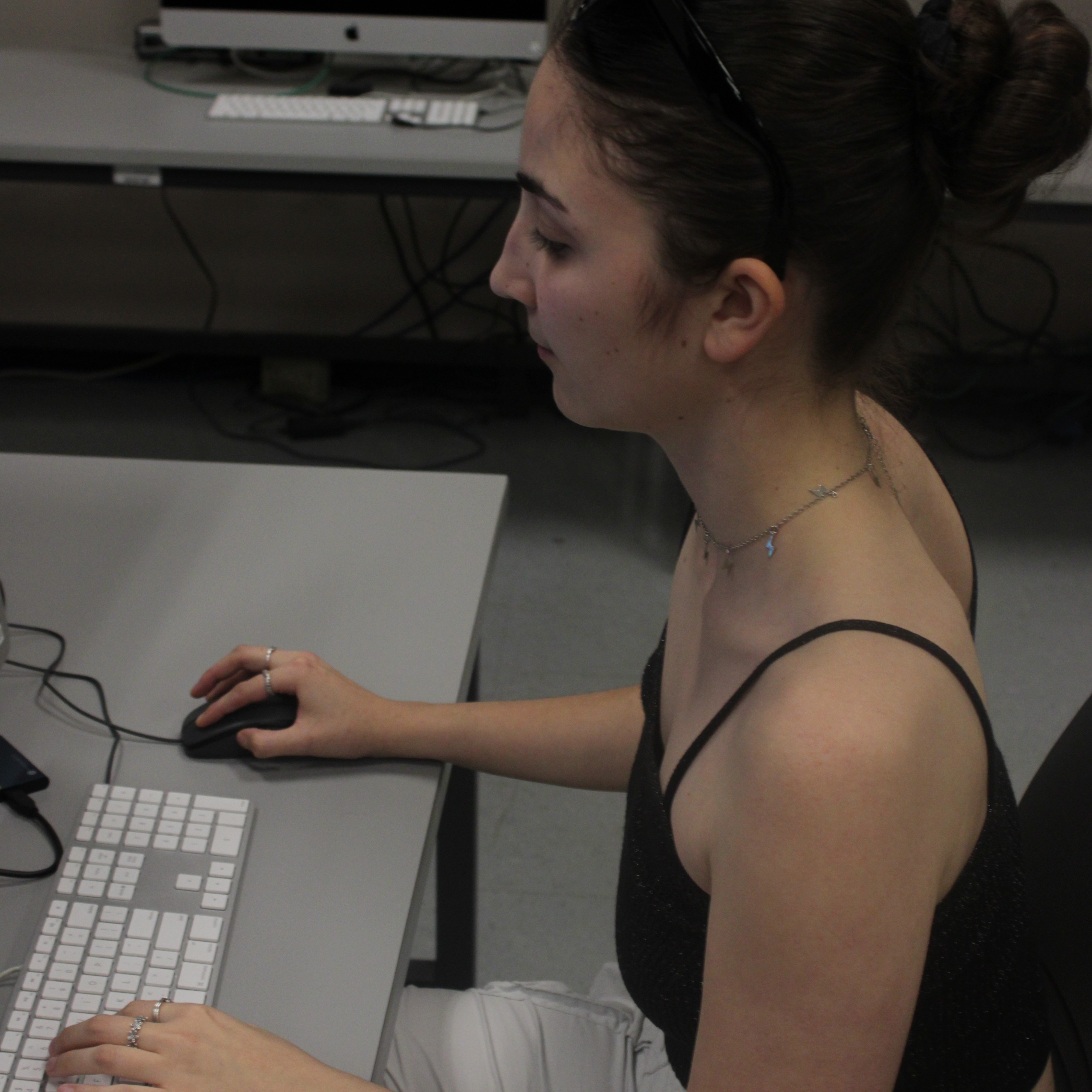 Adrianna working on editing for the video team.